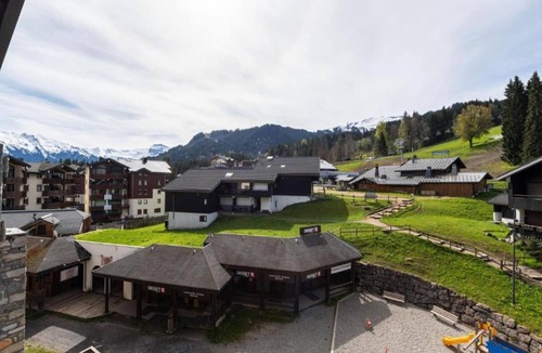 Les Esserts Apartment | Apartment in Morillon with Pool & Mountain Views