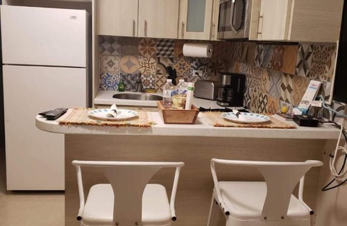 Bucana Apartment | Compact Haven with Private Entrance and FREE Parking and Laundry