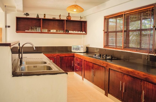 Dencarik Villa | Fabulous villa right on the beach with large pool, tropical garden & staff