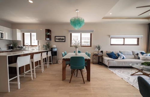 Centro - Supmza 001 Apartment | Wake up to turquoise waters at Isla Bliss 🌴 — a luxury 3-bedroom oceanfront condo just minutes from Isla Mujeres’ best dining and beaches. Enjoy a 90" Smart TV, stunning views, fast WiFi, and easy self-check-in for the perfect island escape. 🌊✨