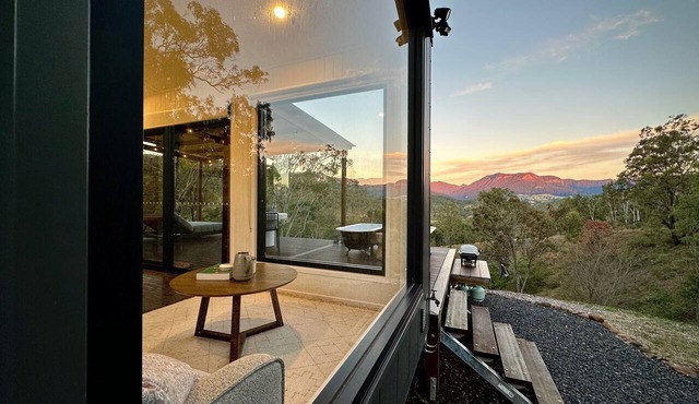 A tranquil getaway awaits. Luxurious cabin with breath-taking mountain views.