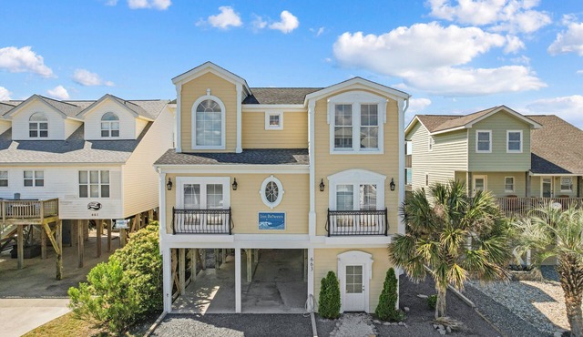 Experience oceanfront bliss at Inn Between, a spacious 6-bedroom getaway in Holden Beach.