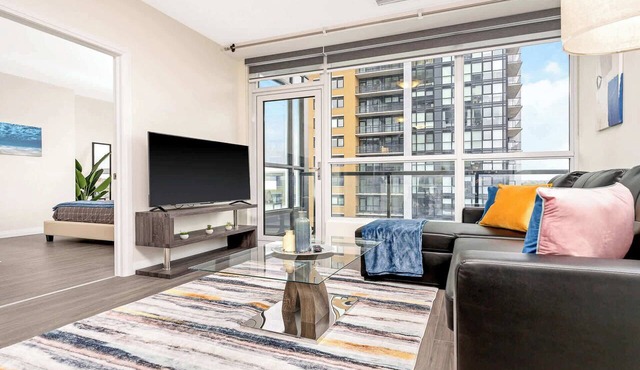 Modern High Rise Condo w Private Patio—Downtown