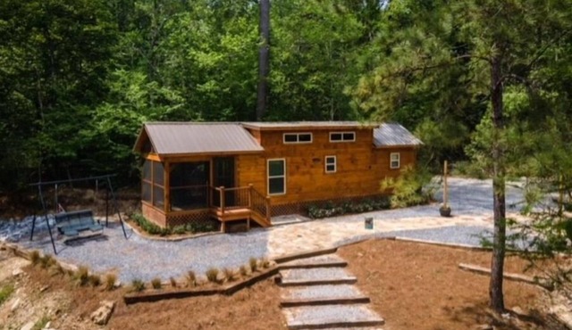 Secluded cozy tiny cabin on the water with fire pit and private dock